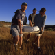 Scientists led by Krause carrying plaster-wrapped A. hui skeleton